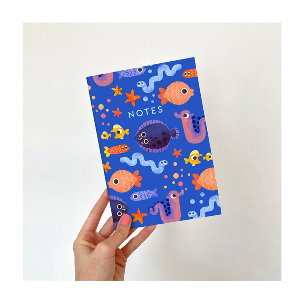 
                  
                    A bright and fun A5 notebook with a sea creature design by Emily Nash. Perfect for all of your doodles, lists and creative ideas, to give as a gift or keep for yourself!
                  
                