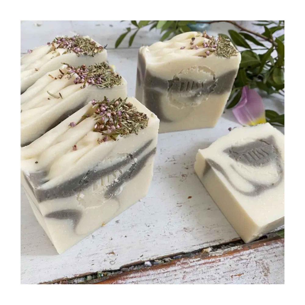 
                  
                    Lavender and Bergamot Vegan Soap topped with lavender and larkspur flower petals
                  
                