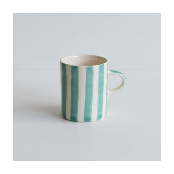 A colourful handcrafted mug from Musango in their Mint candy stripe glaze.