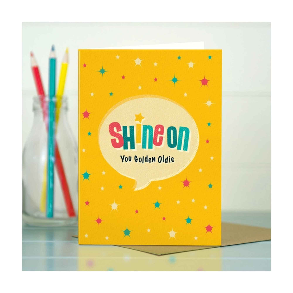 
                  
                    A retro typographic birthday card by The Typecast Gallery. It features the phrase "Shine on you Golden Oldie" in a colourful, retro style. A cheeky greeting that's the perfect way to say happy birthday for the older gent.
                  
                