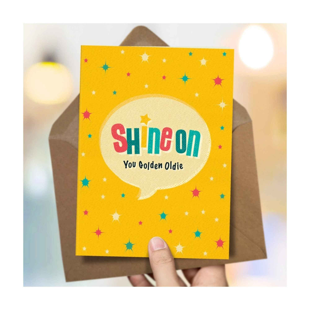 
                  
                    A retro typographic birthday card by The Typecast Gallery. It features the phrase "Shine on you Golden Oldie" in a colourful, retro style. A cheeky greeting that's the perfect way to say happy birthday for the older gent.
                  
                