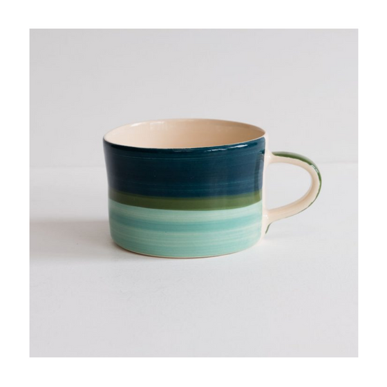 A colourful handcrafted mug from Musango in their Tundra tri-colour glaze. 