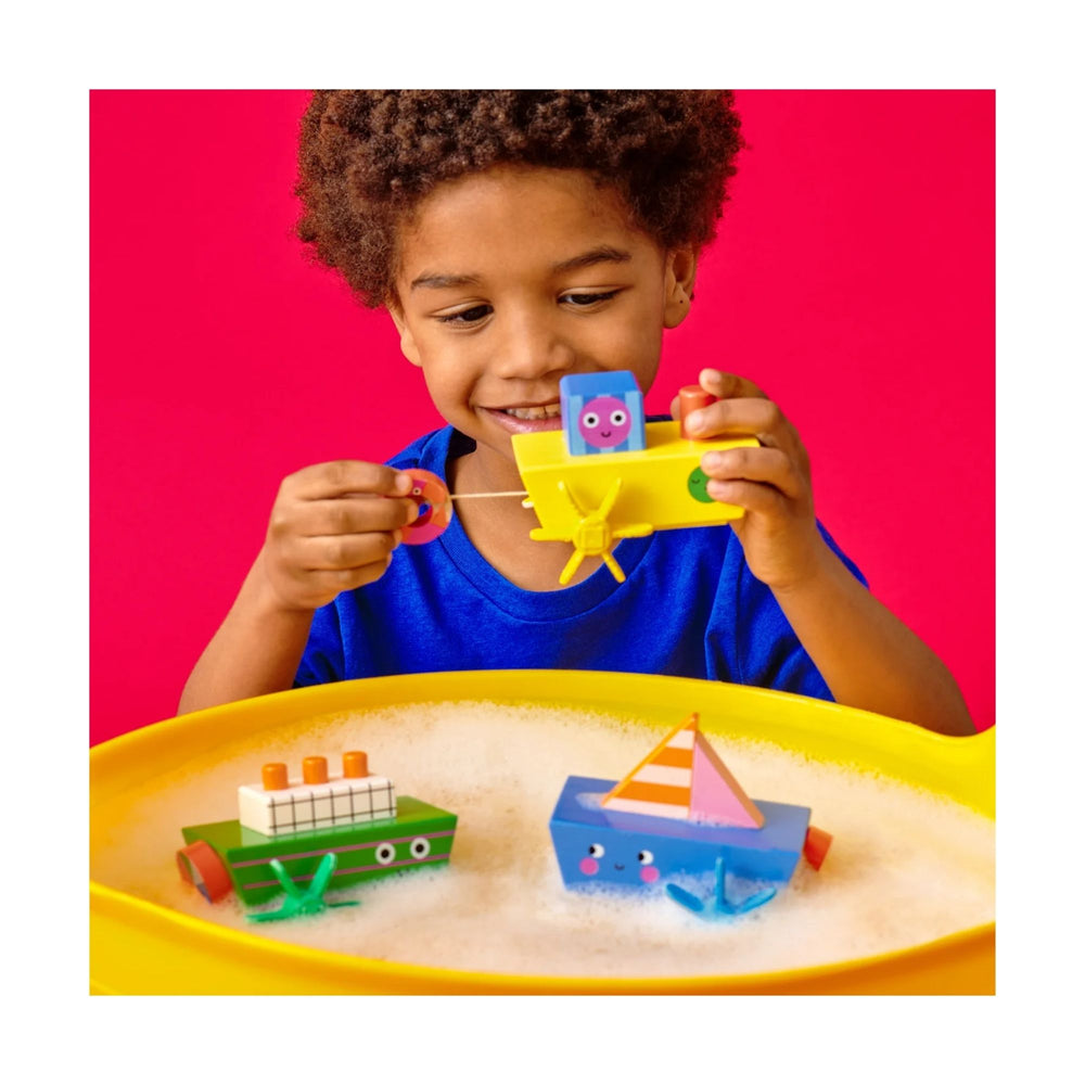 Colourful wooden wind-up boats from Kikkerland. Set sail on bathtime adventures with interactive, pull string bath boats! Wooden boat zips through water as the propellers turn. Available in 3 friendly boat styles.&nbsp;